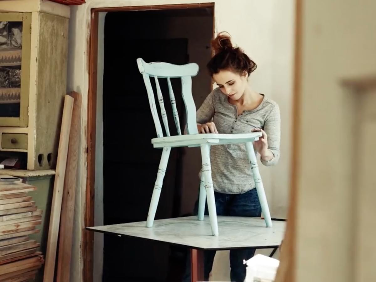 Image of a independent retailer working on a custom dining chair. Click to play a video about MessageDemon's mission to lead the ecommerce rebellion.